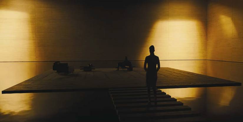 Wallace's office in Blade Runner 2049: a single raised floor suspended in a vast golden room, built around one occupant