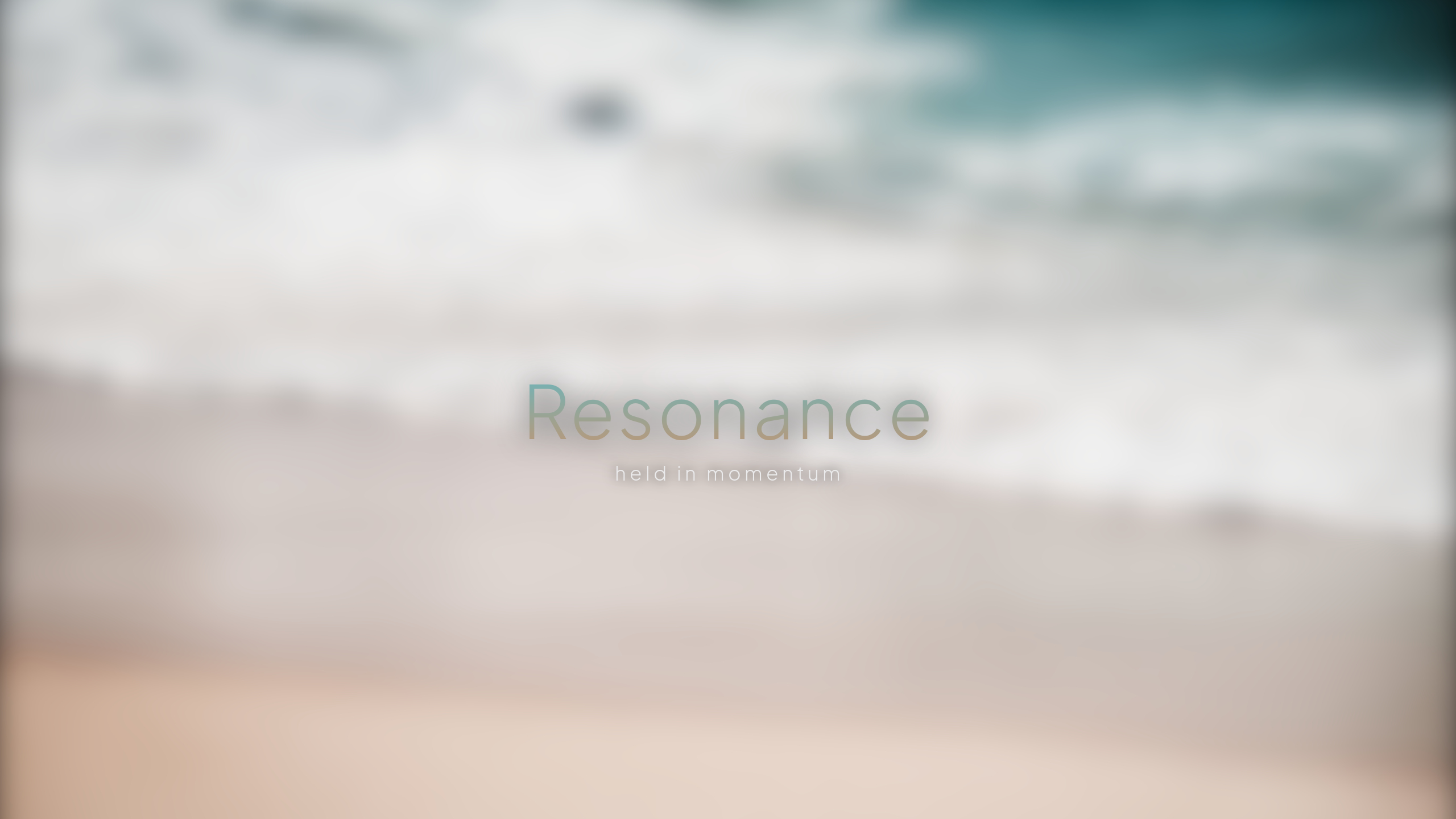 The Resonance boot intro: the word mark over the blurred wallpaper, subtitle 'held in momentum'